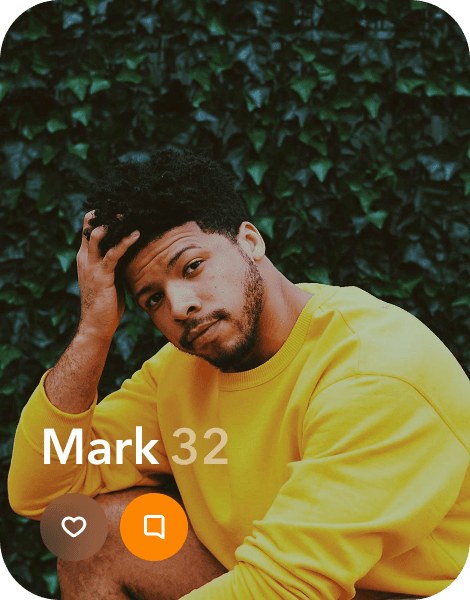 a profile of a man in a yellow shirt running his fingers through his hair
