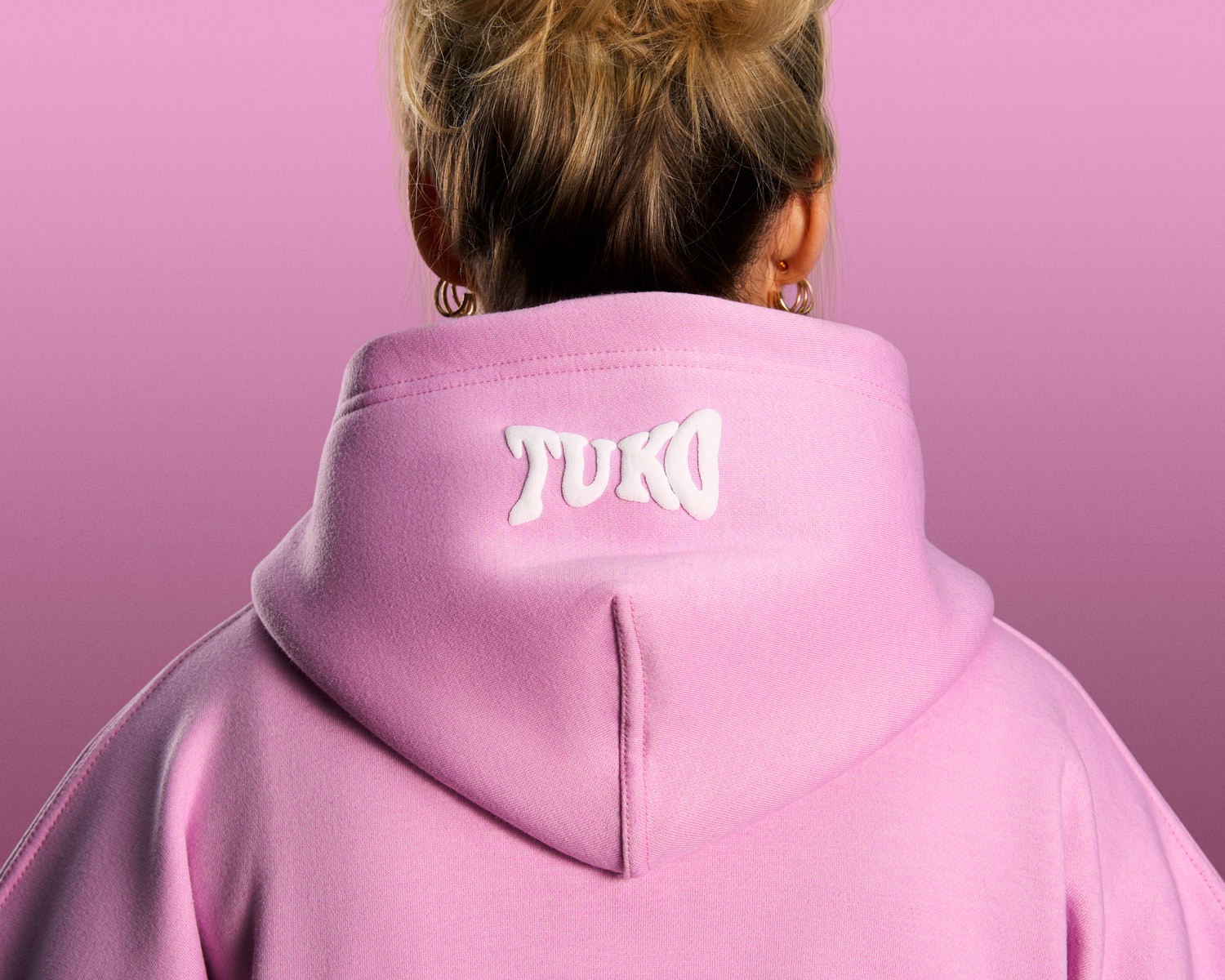 Tuko Clothing pink Dandadan inspired tracksuit detail shot photographer by Matthew Brown (London product photographer).