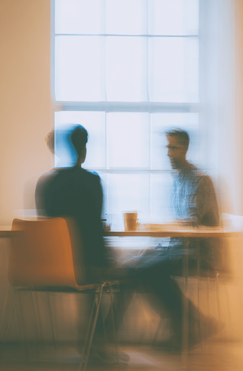 Close-up of a premium fine dining experience with gourmet food and dark marble decor, representing the high-quality lifestyle perks and rewards available to employees