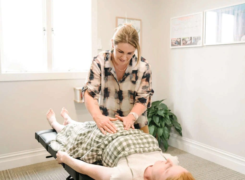 Pregnant Women getting chiropractic adjustment 3