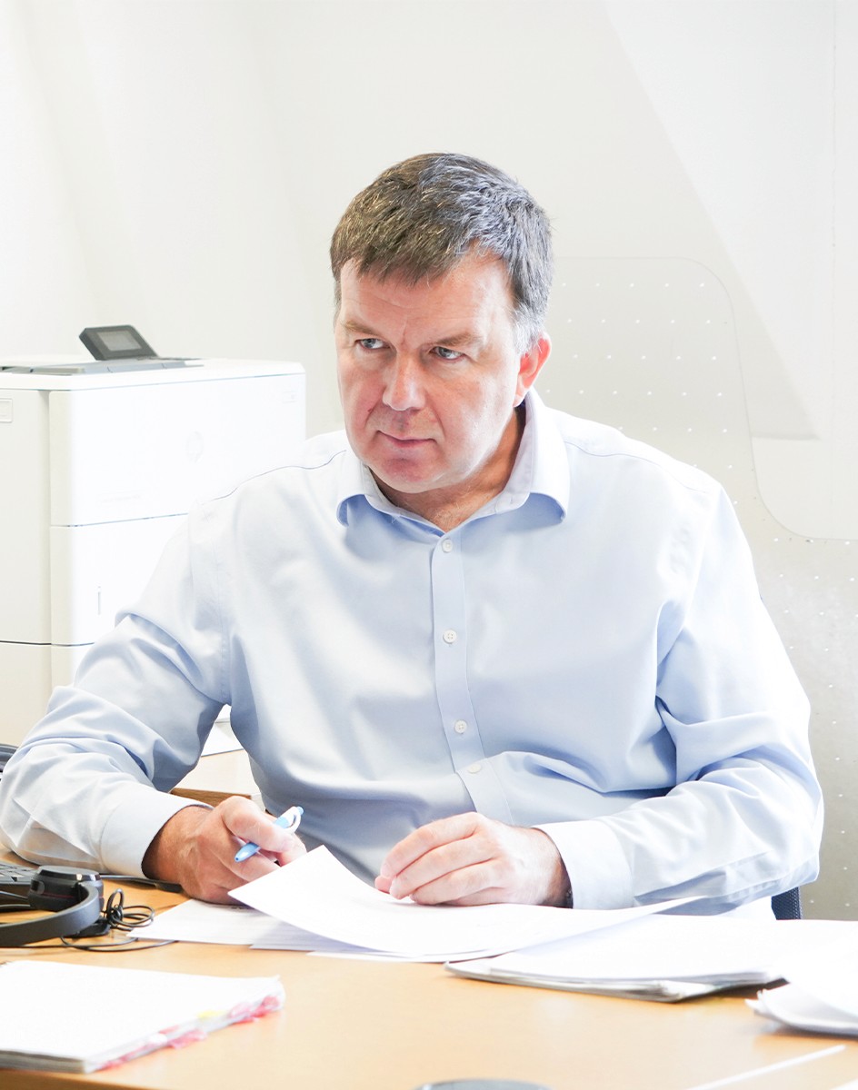 Composite image of the Hughes Price Walker pension support team working in the office.