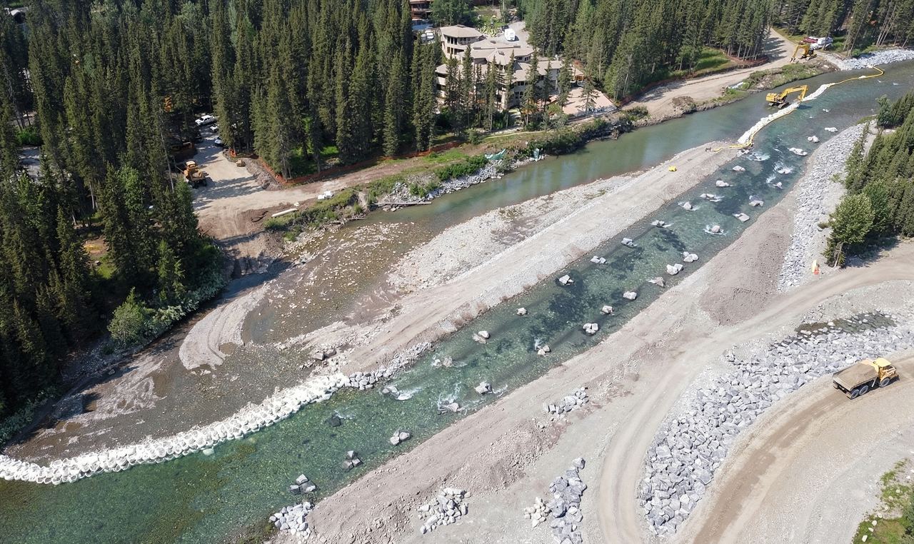 Aerial view of Bragg Creek flood mitigation showing temporary river diversion and erosion control measures