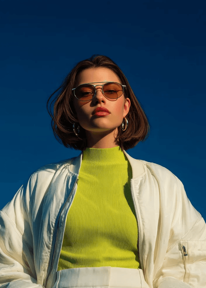 Woman wearing yellow turtleneck sweater.