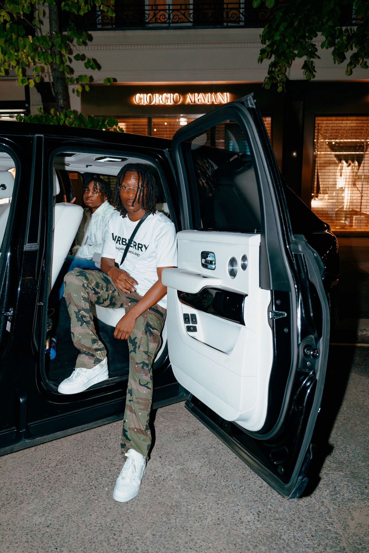 Luxury cars parked inside store.