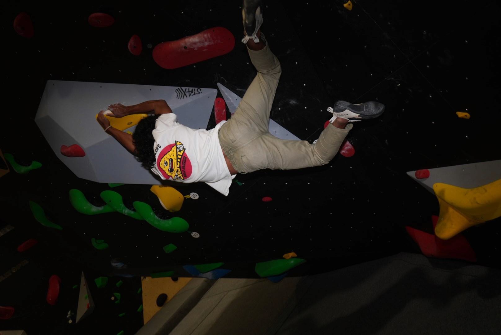 Climber on indoor bouldering wall at toko bloc bali