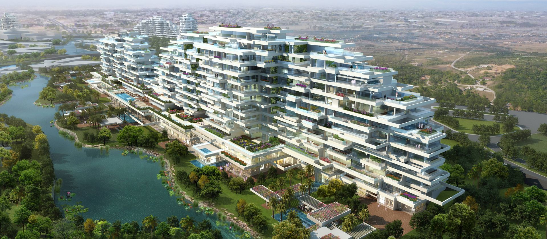 The skyline at sunset from a rooftop, displaying a blend of warm colors and the outline of buildings against the sky.