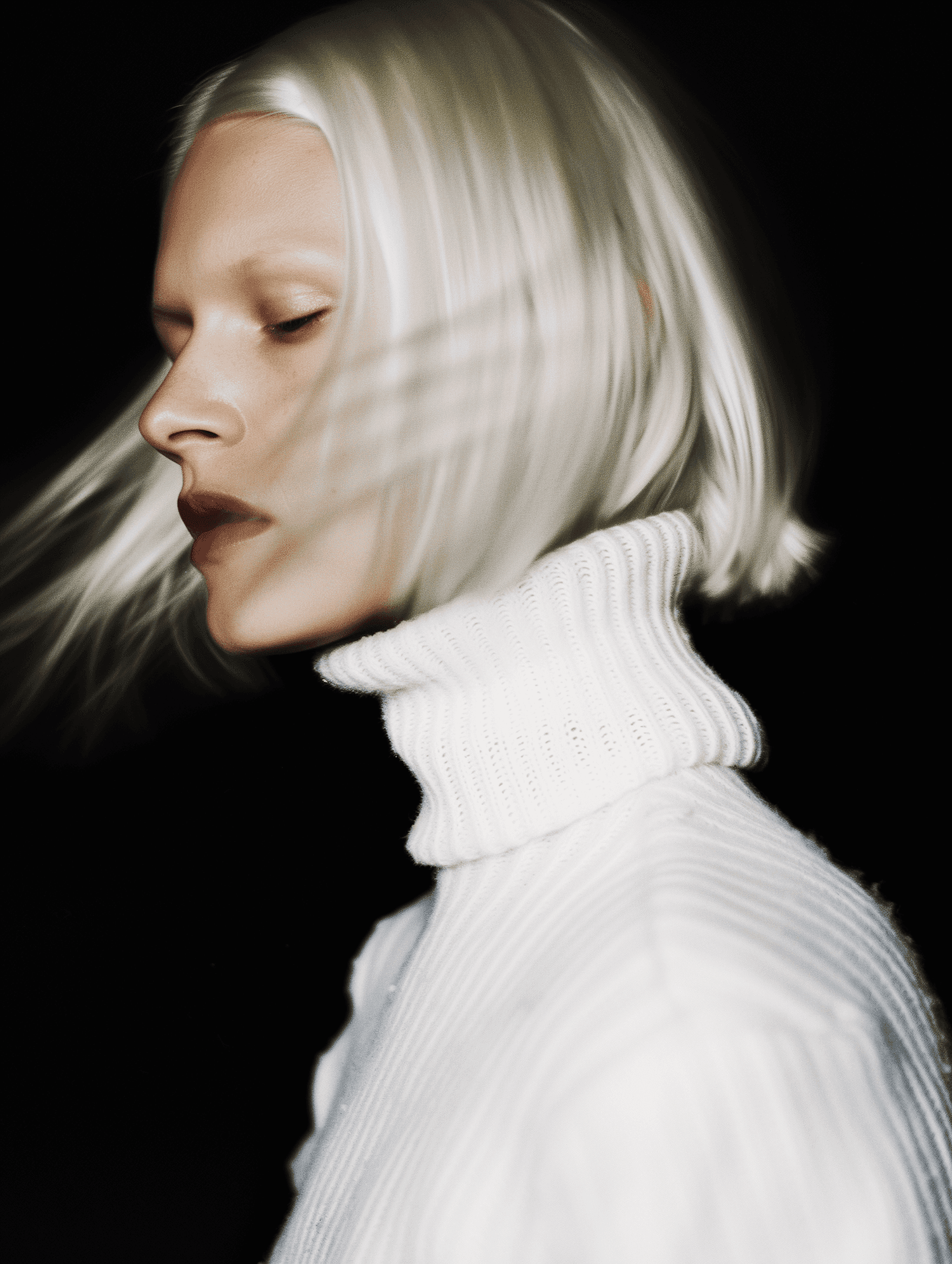 Woman in white turtleneck looking sideways