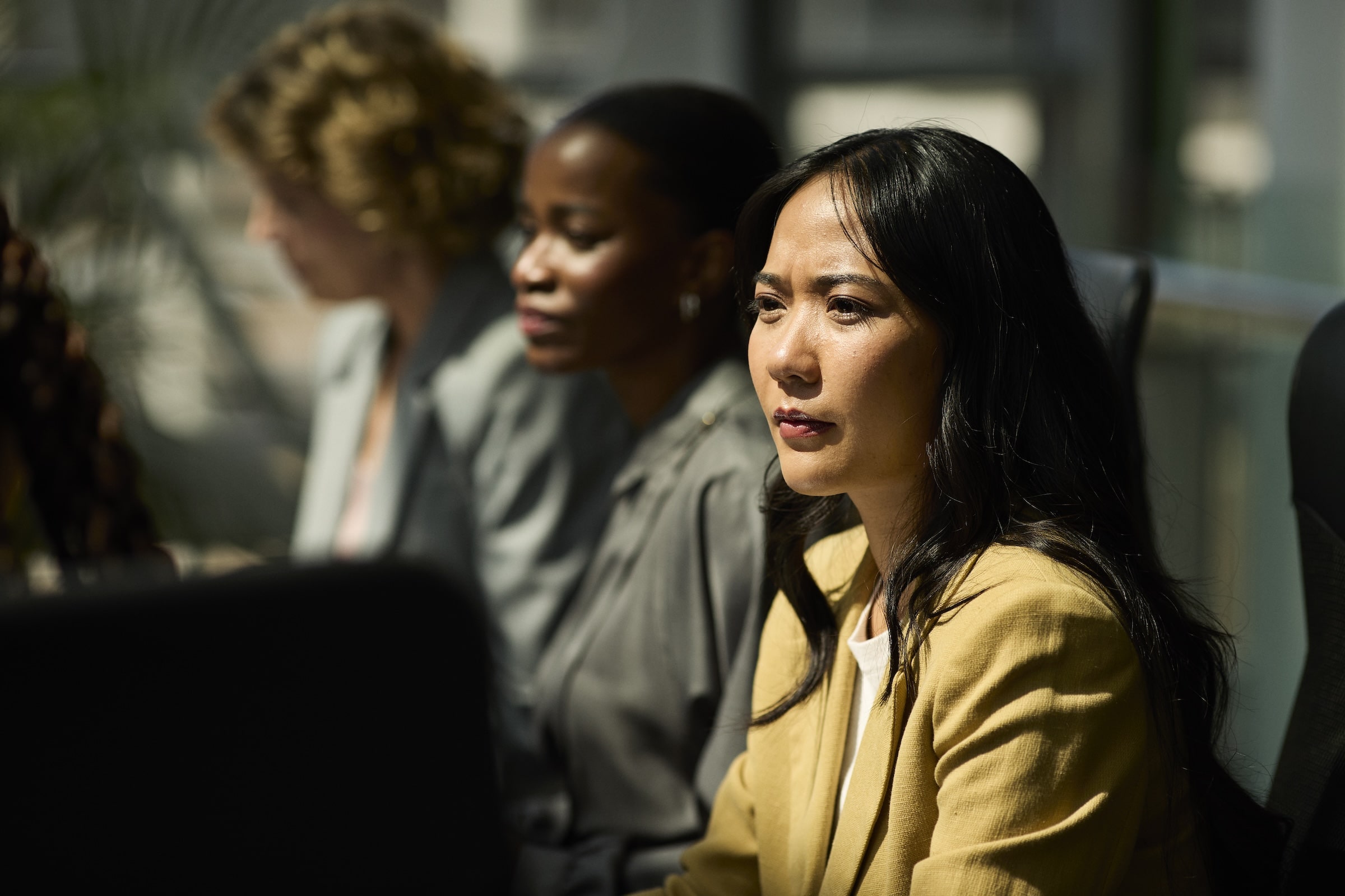 Man holding sd card with camera and mountain landscape.