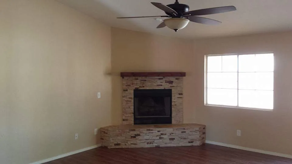 Ceiling fan installed in a finished Tucson living room by Silva Diversified Construction