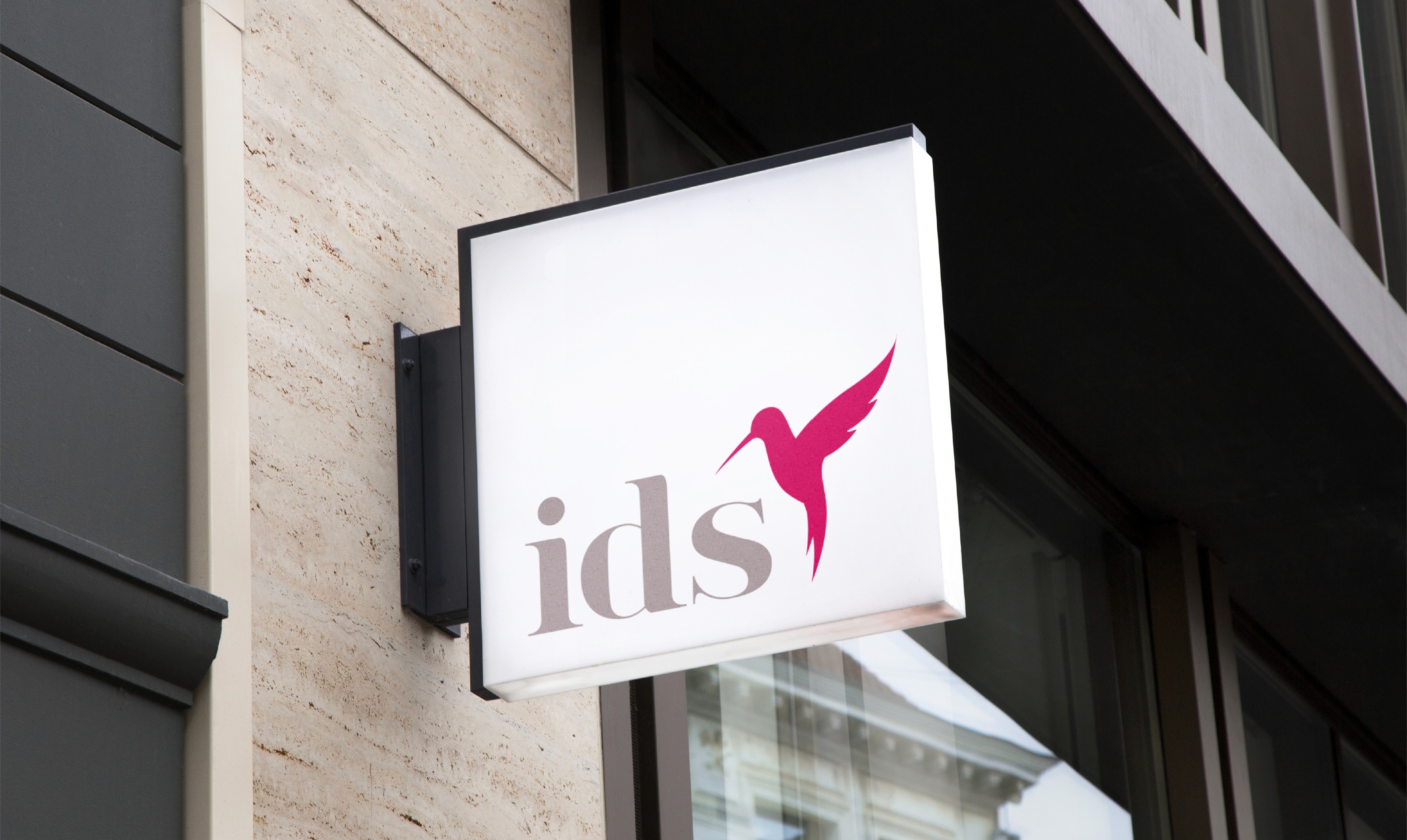 IDS logo on illuminated sign