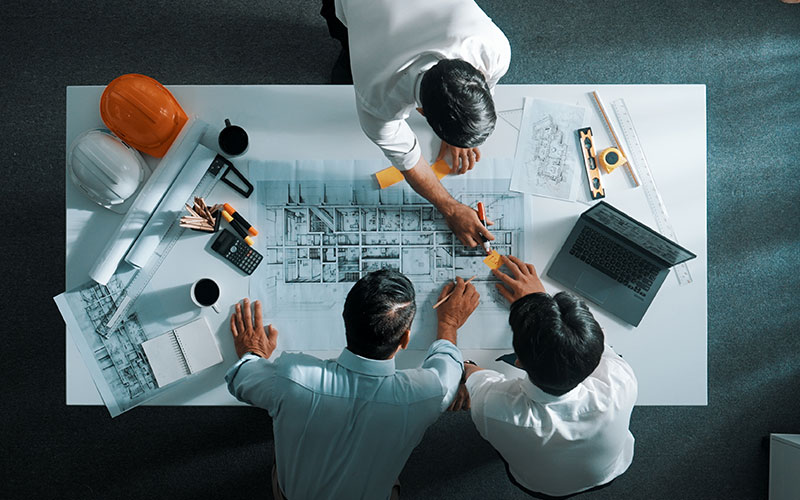 Two men looking at a laptop together