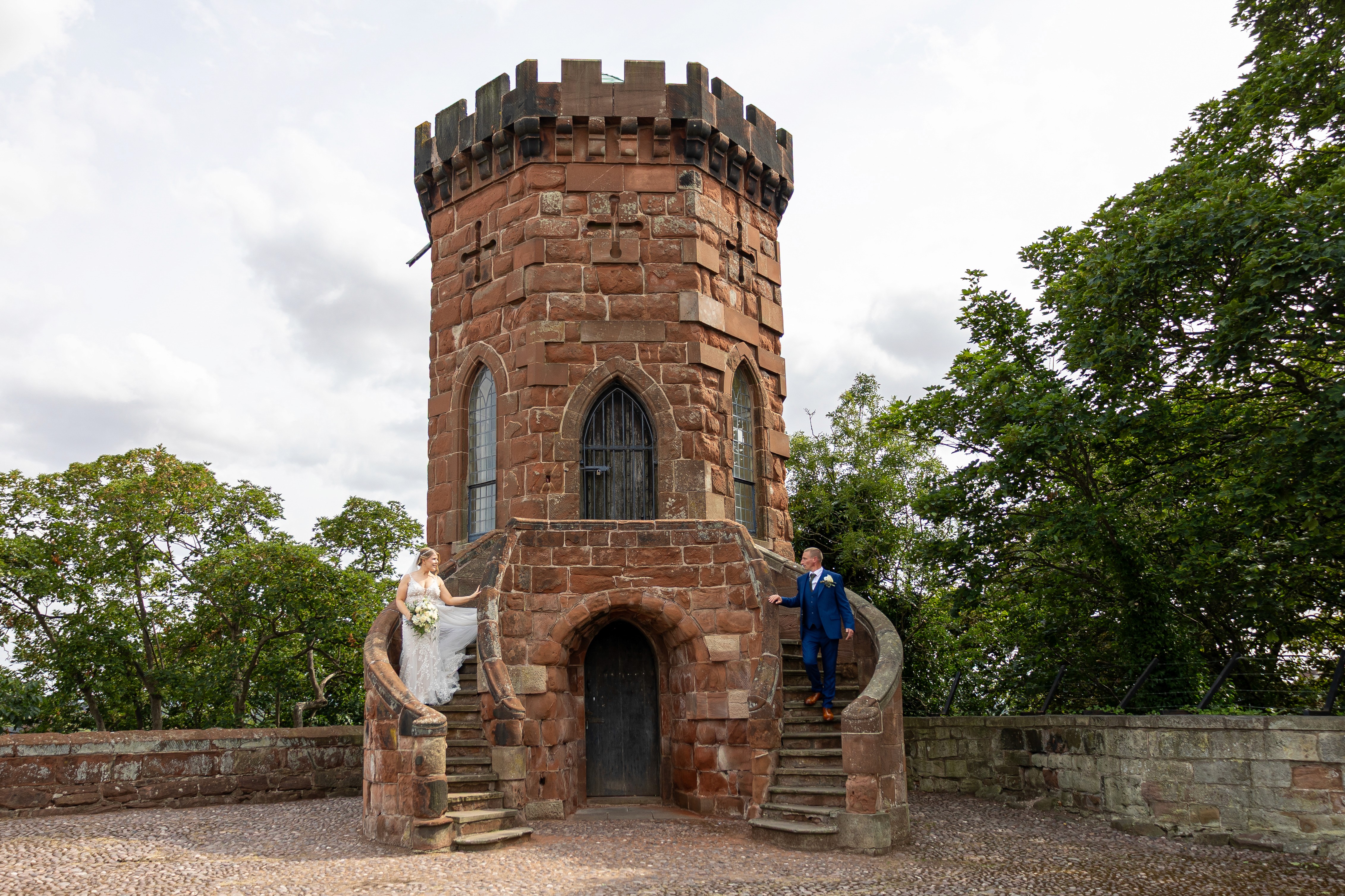 Will and Becs standing on either side of a historic tower at Shrewsbury Castle