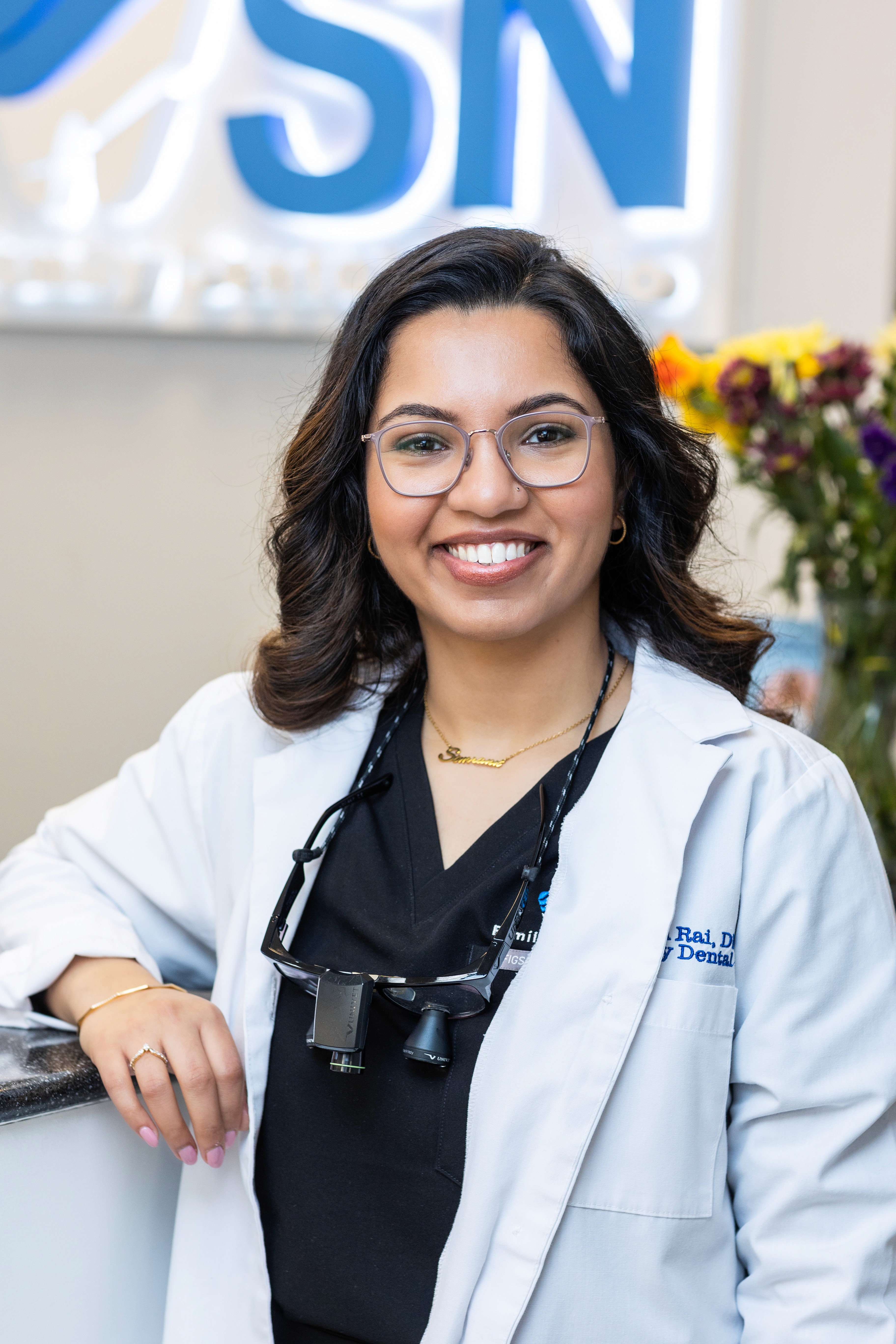 Dr. Simrann Rai Sethi smiling in the Milltown dental office