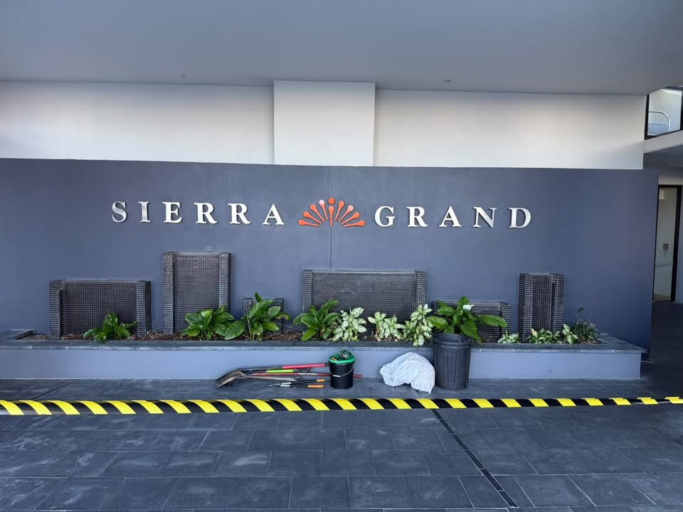High access commercial garden maintenance on elevated tiered garden beds at a Surfers Paradise high-rise building Gold Coast