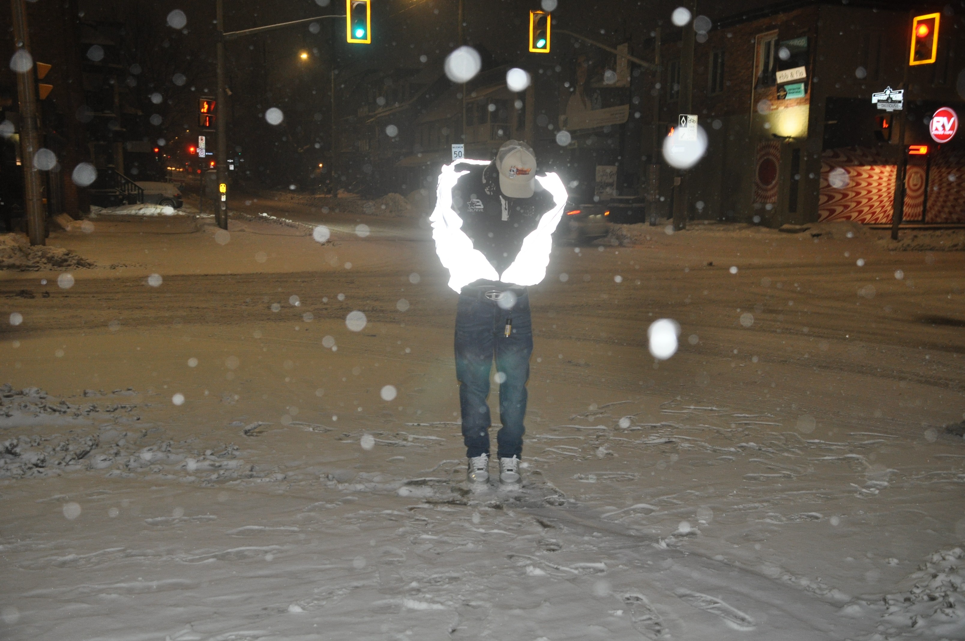 a blurry photo of a person standing in front of a wall