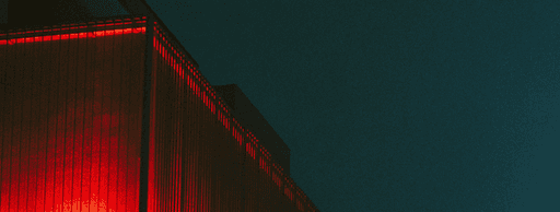 a stack of red boxes sitting next to each other