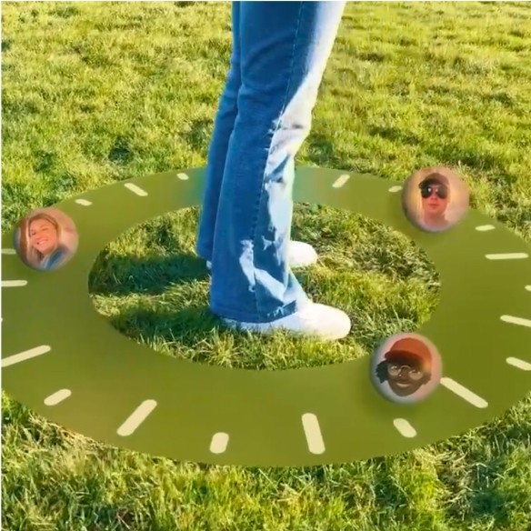 Photo of a person standing on grass with a floating UI of a compass at their feet