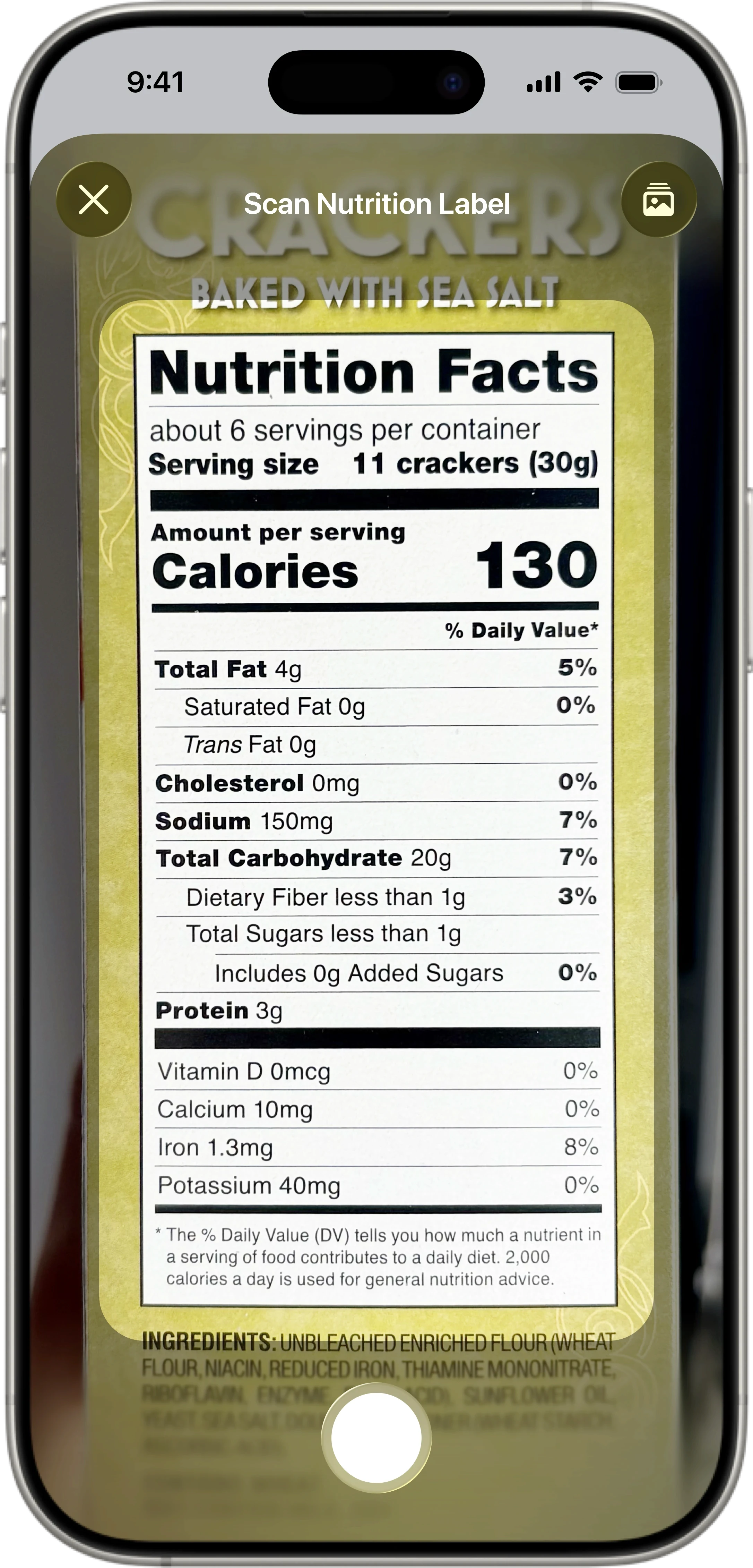 Foodnoms app scanning a nutrition label to automatically log food and track calories, fat, sodium, and protein