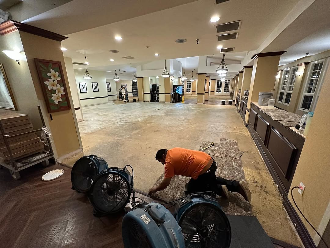 Dining hall floor cleared and dried with air movers before recarpeting