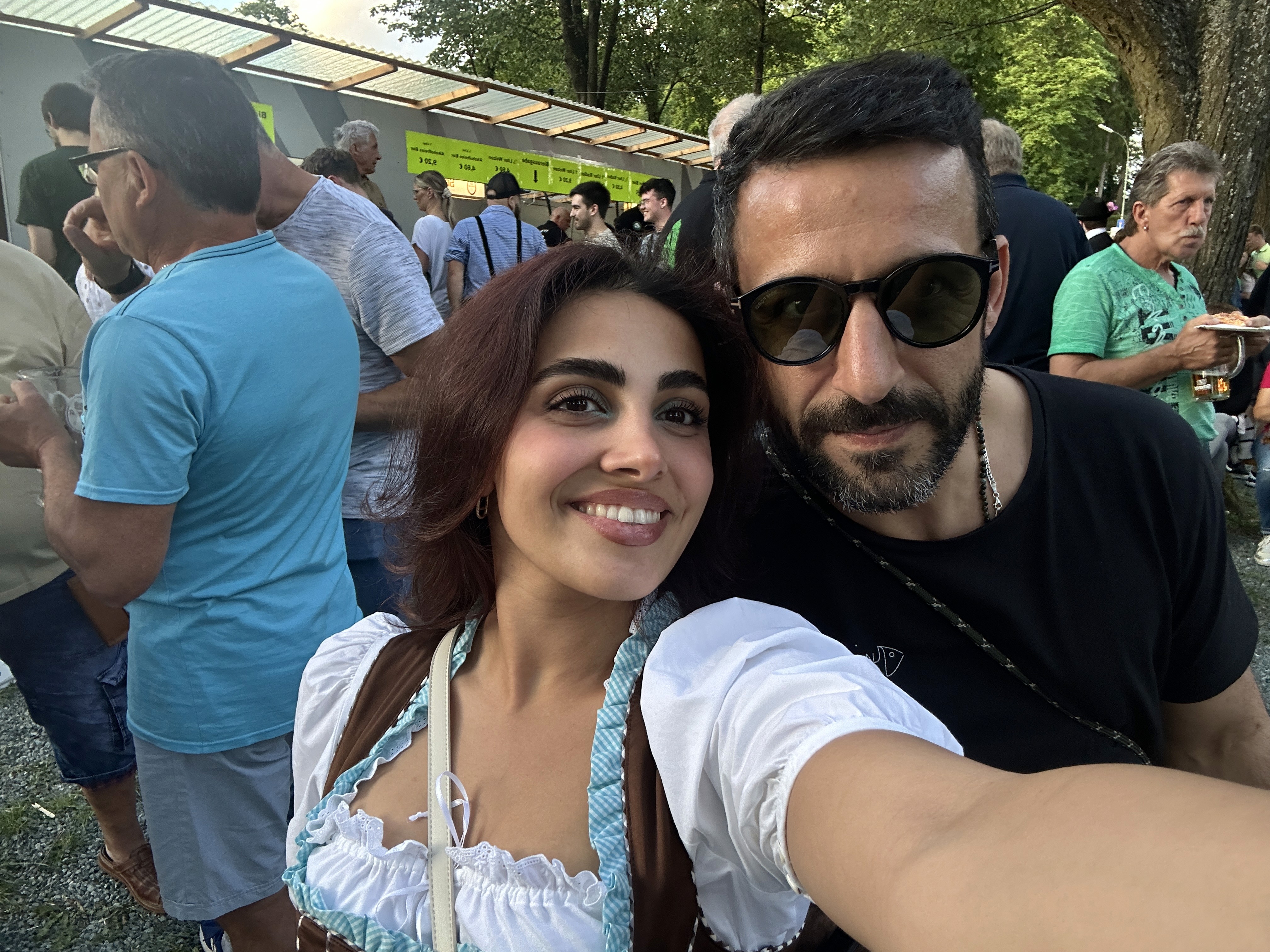 Person sitting on a ledge overlooking New York City skyline