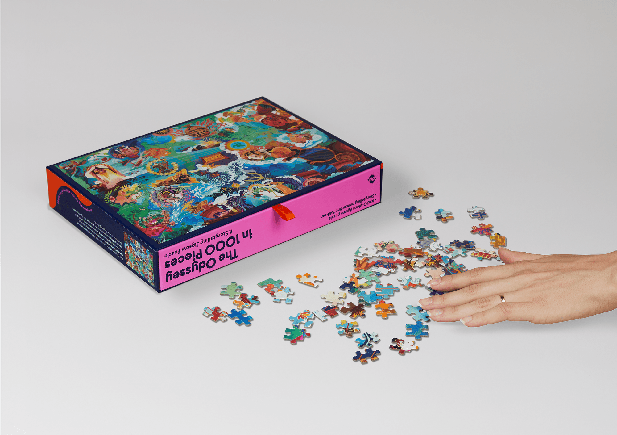 Hands assembling The Odyssey jigsaw puzzle designed for Thames & Hudson.