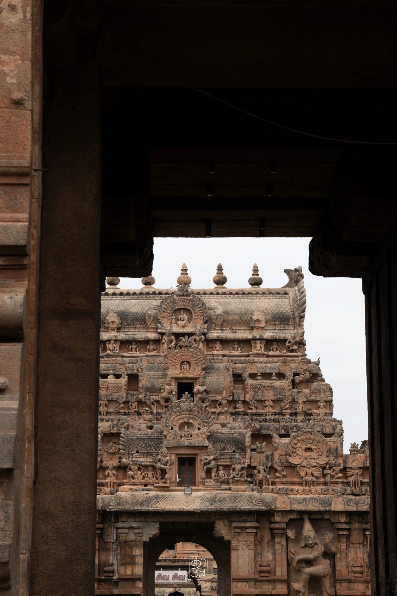 A gopuram framed by a temple doorway