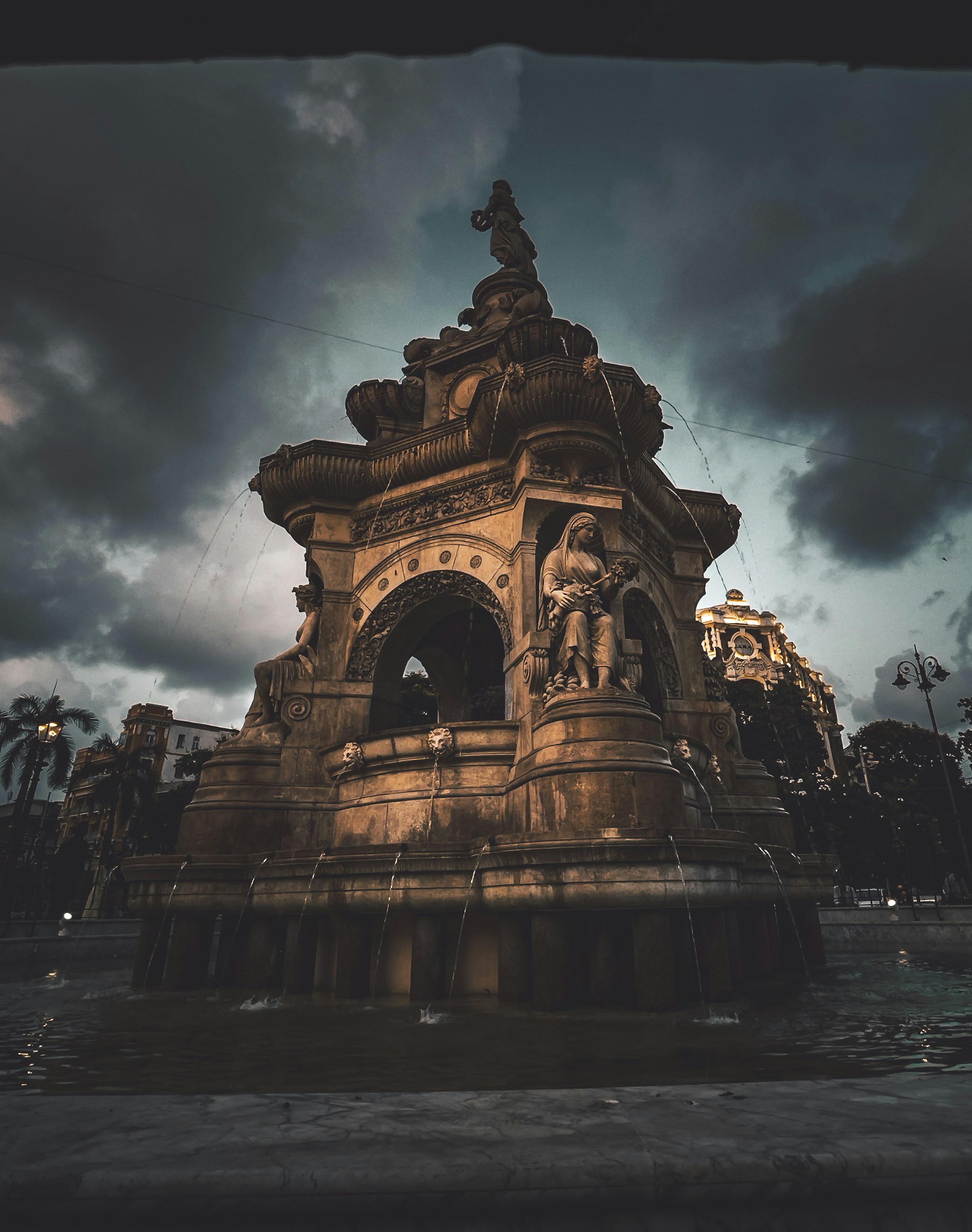 a fountain with a statue on top of it