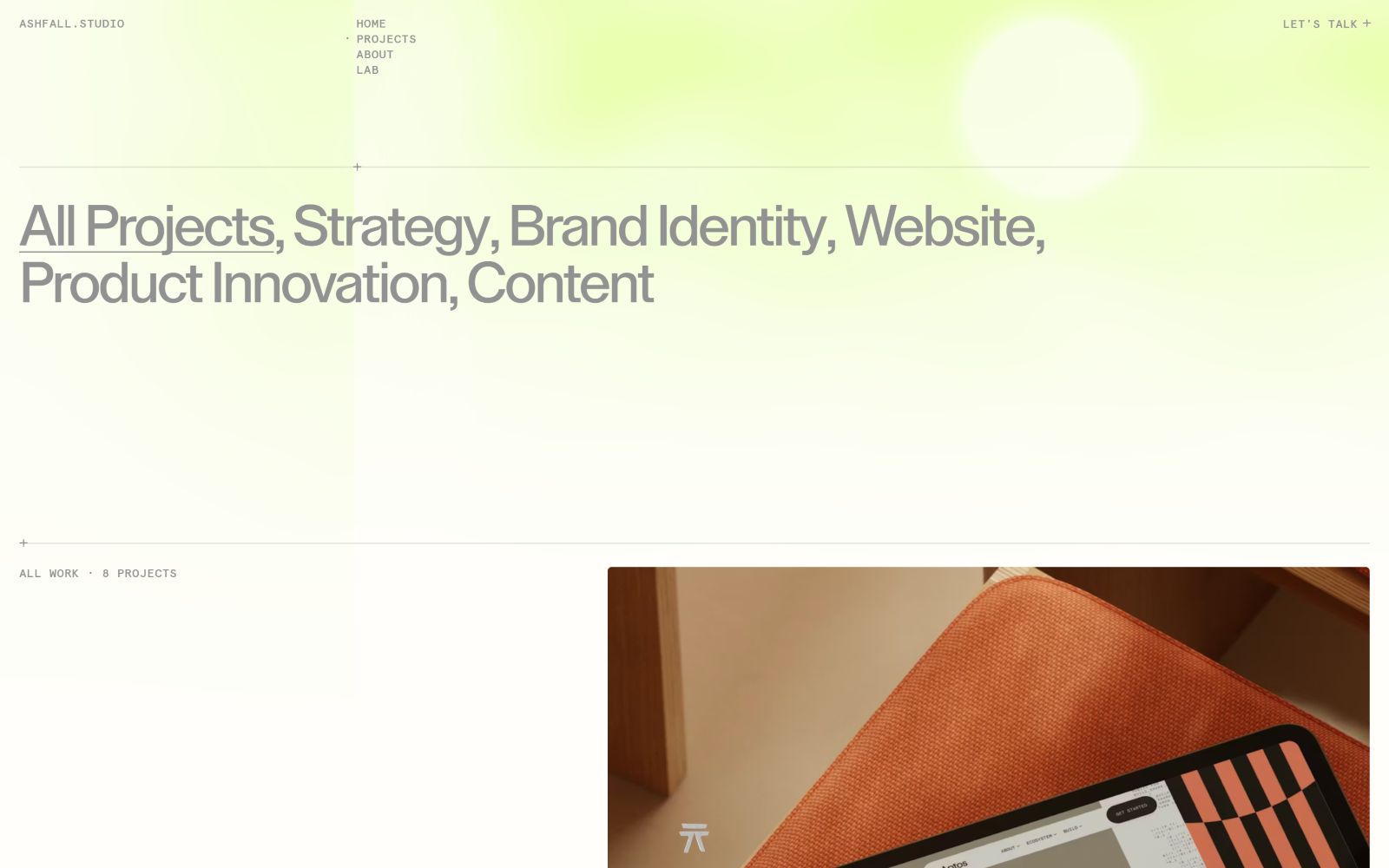 Bright website with minimalist design; header with navigation links. Text reads, “All Projects, Strategy, Brand Identity.” Below, a project preview.