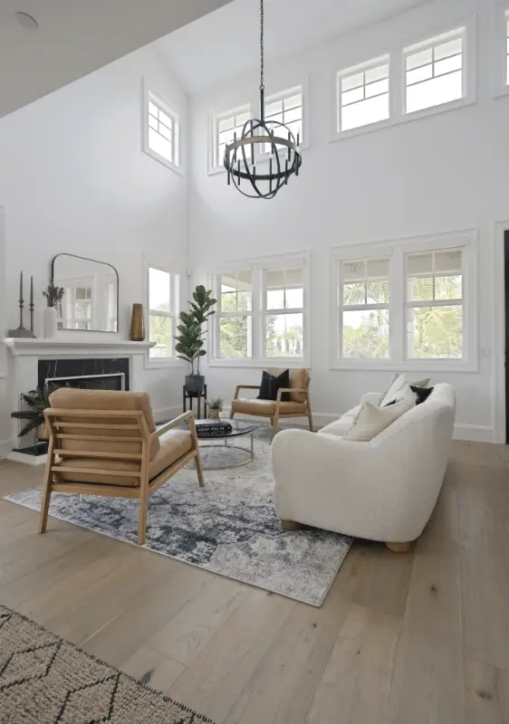 Portrait shot of the front living room taken from an angle, showcasing the furniture and decor in the Dana Point Remodel. Photo by Todd Huge.