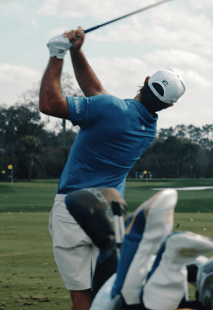 Girl is sitting on a gate