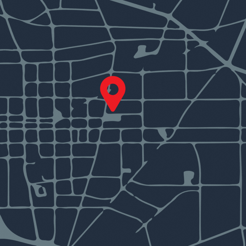 A red pin marker surrounded by blue ones.