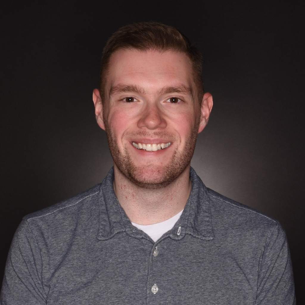 Smiling screenwriting student in a studio portrait