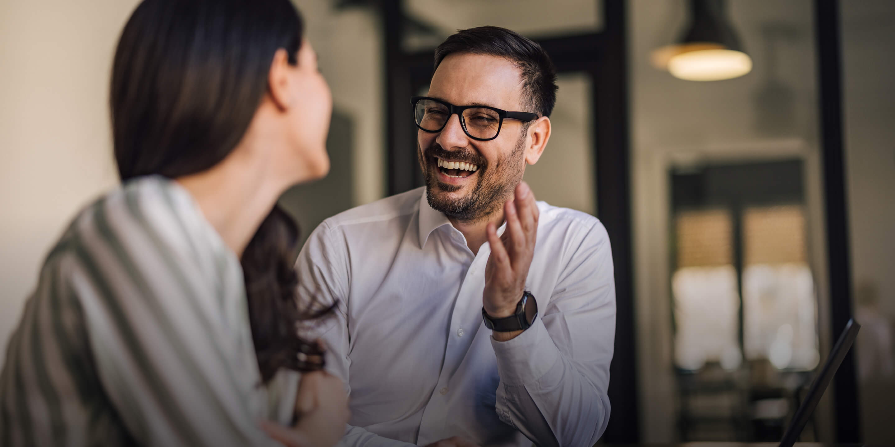 Two professionals having a friendly conversation