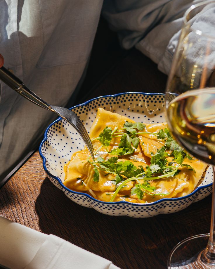 Handcrafted ravioli infused with Indian flavors and fresh herbs, symbolizing the global techniques and spice-rooted cultural narratives behind Dhoom’s modern menu.