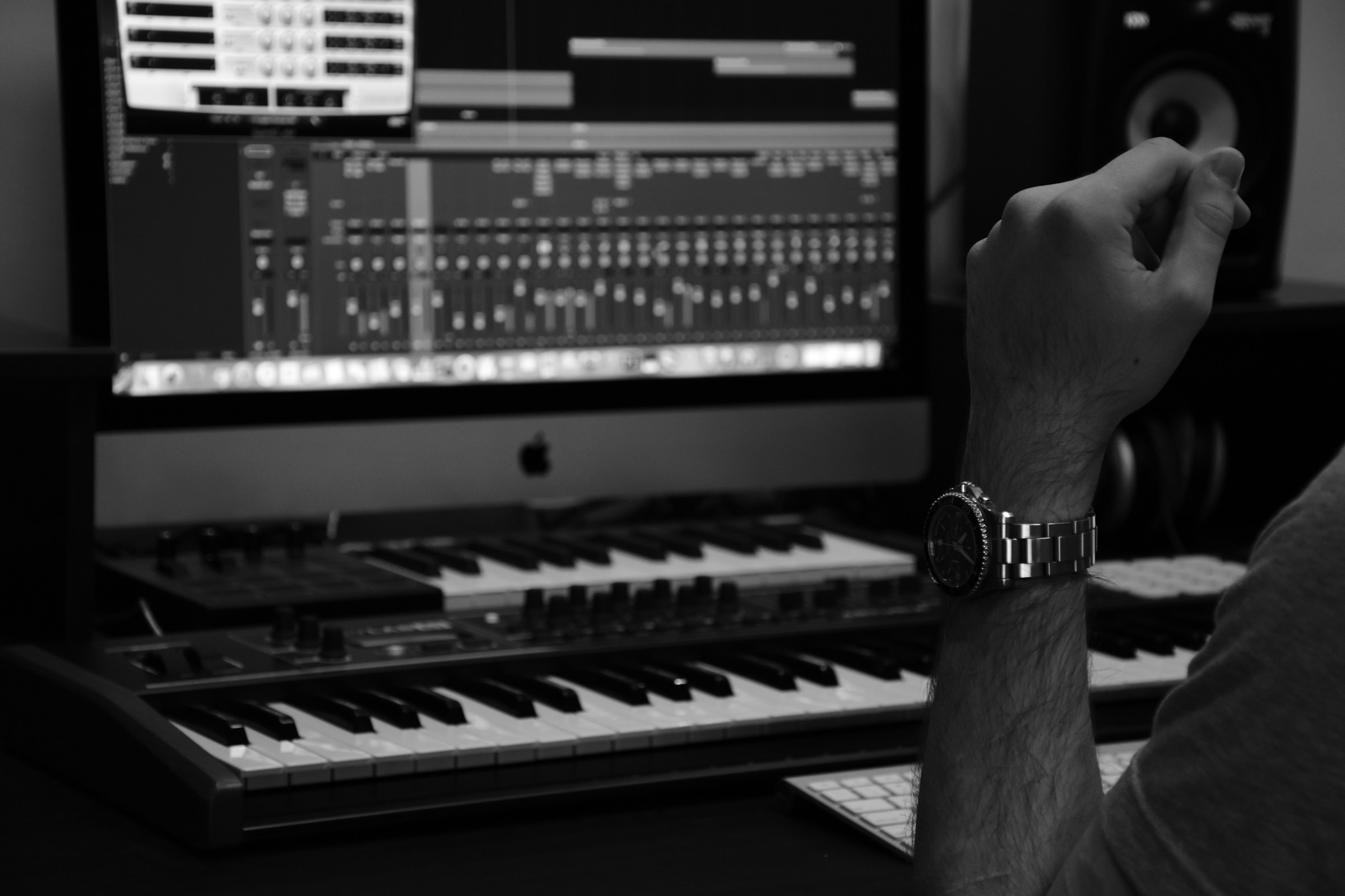 man creating rap music - Music Producer vs. Composer