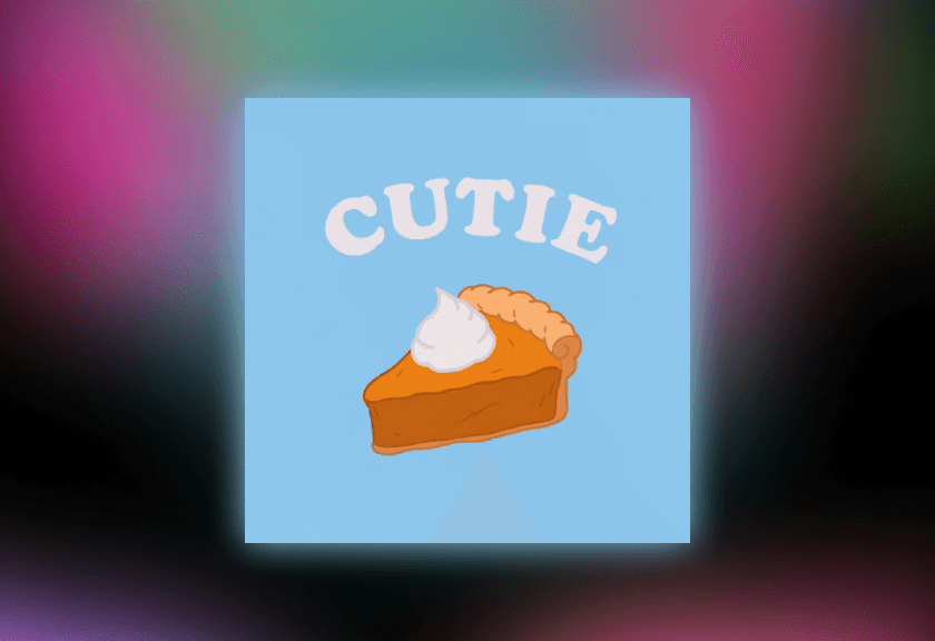 Cartoon slice of pumpkin pie with whipped cream and the word “Cutie” in soft blue.