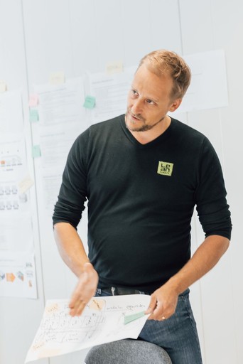 Close-up of a tree stump showing growth rings and a textured brown wood surface.