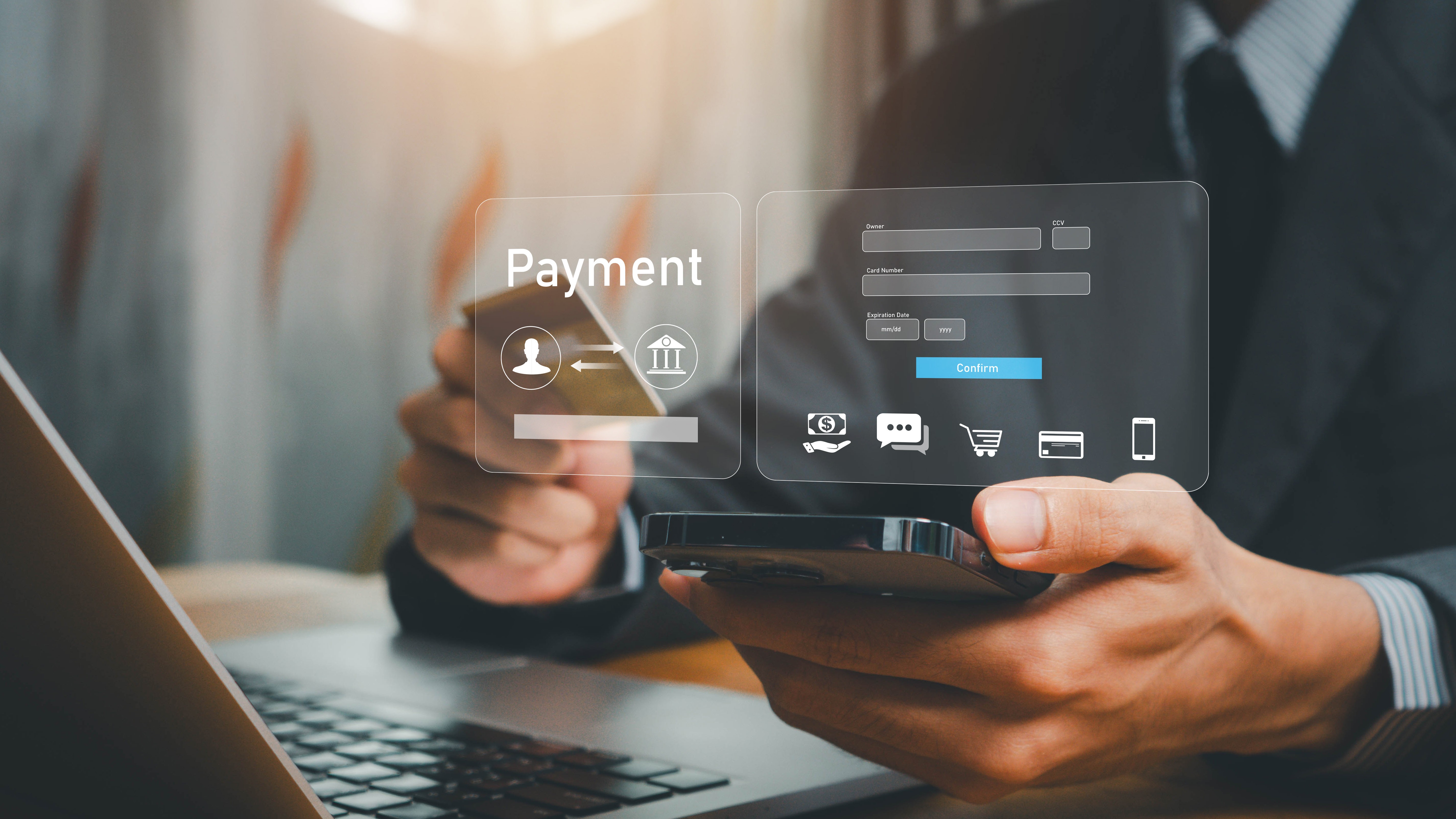 Person holding a payment card and smartphone beside a laptop, with an overlaid digital payment interface.