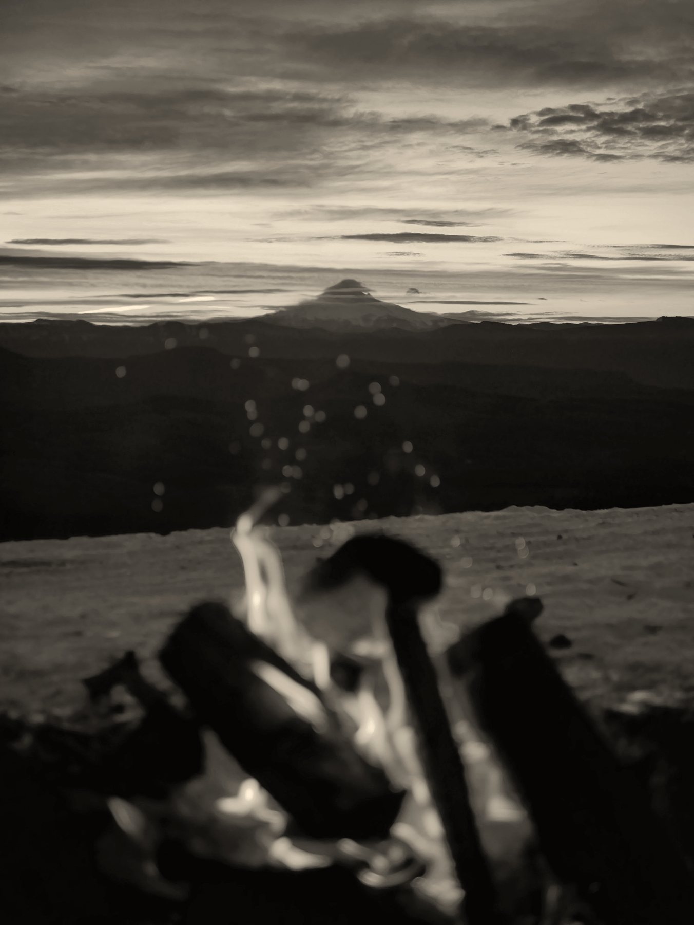 A campfire burning at dusk