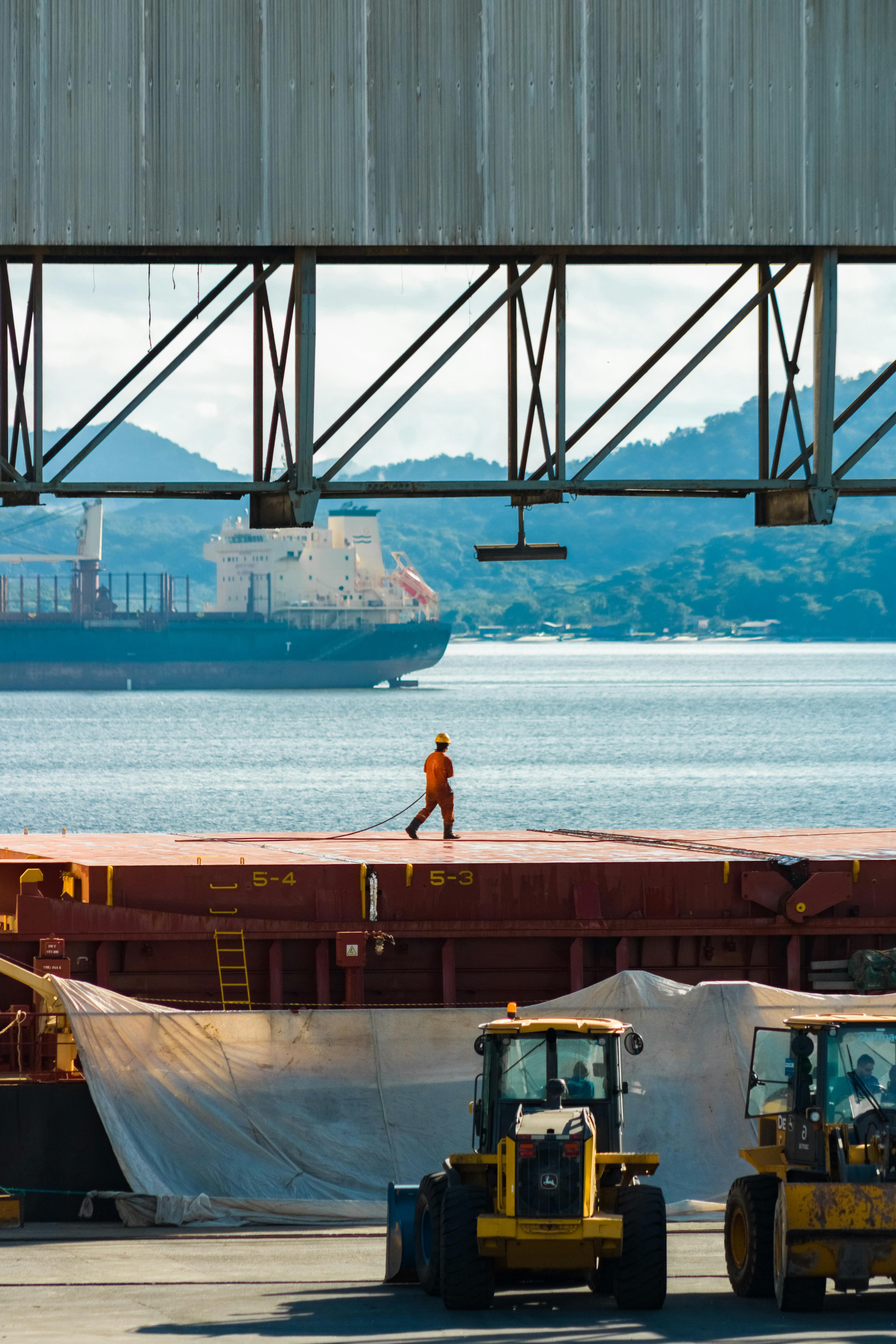 port worker walking on ship deck