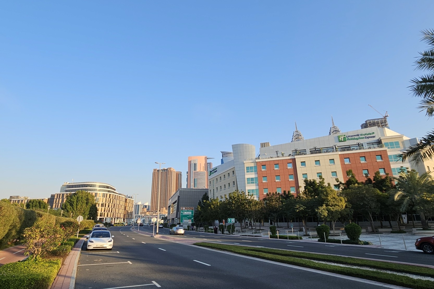 A vibrant blue sky above the Al Sufouh 2 area, indicating clear weather and sunshine.