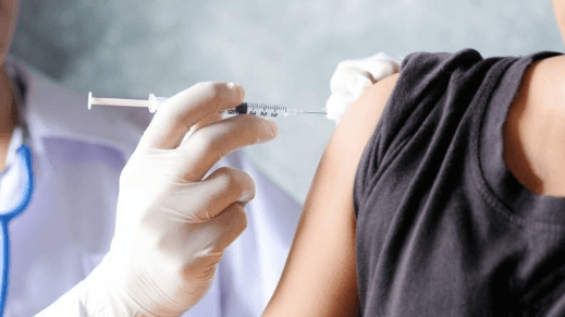 A person getting a shot

AI-generated content may be incorrect.