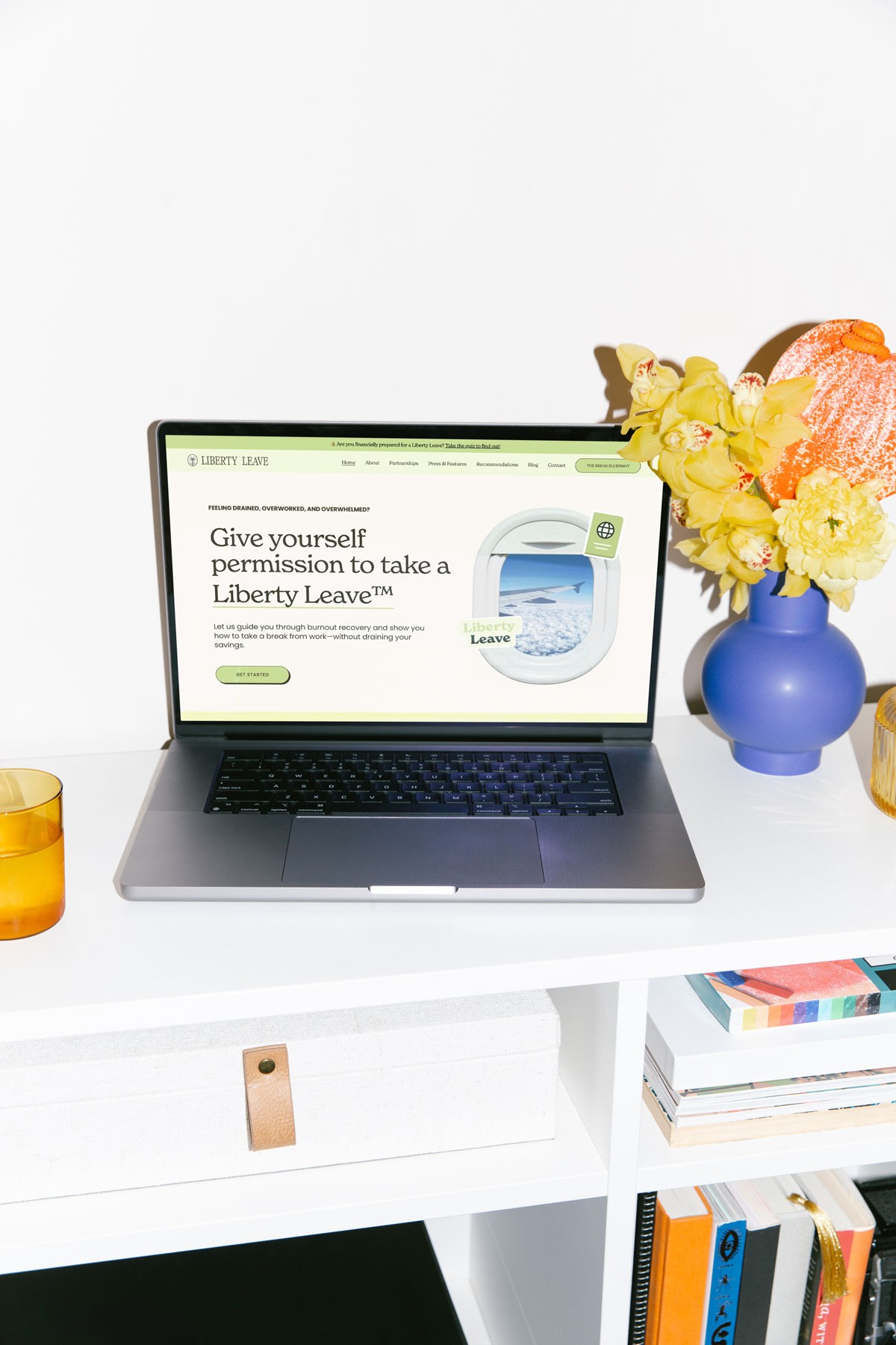 mockup of Liberty Leave's homepage on a laptop