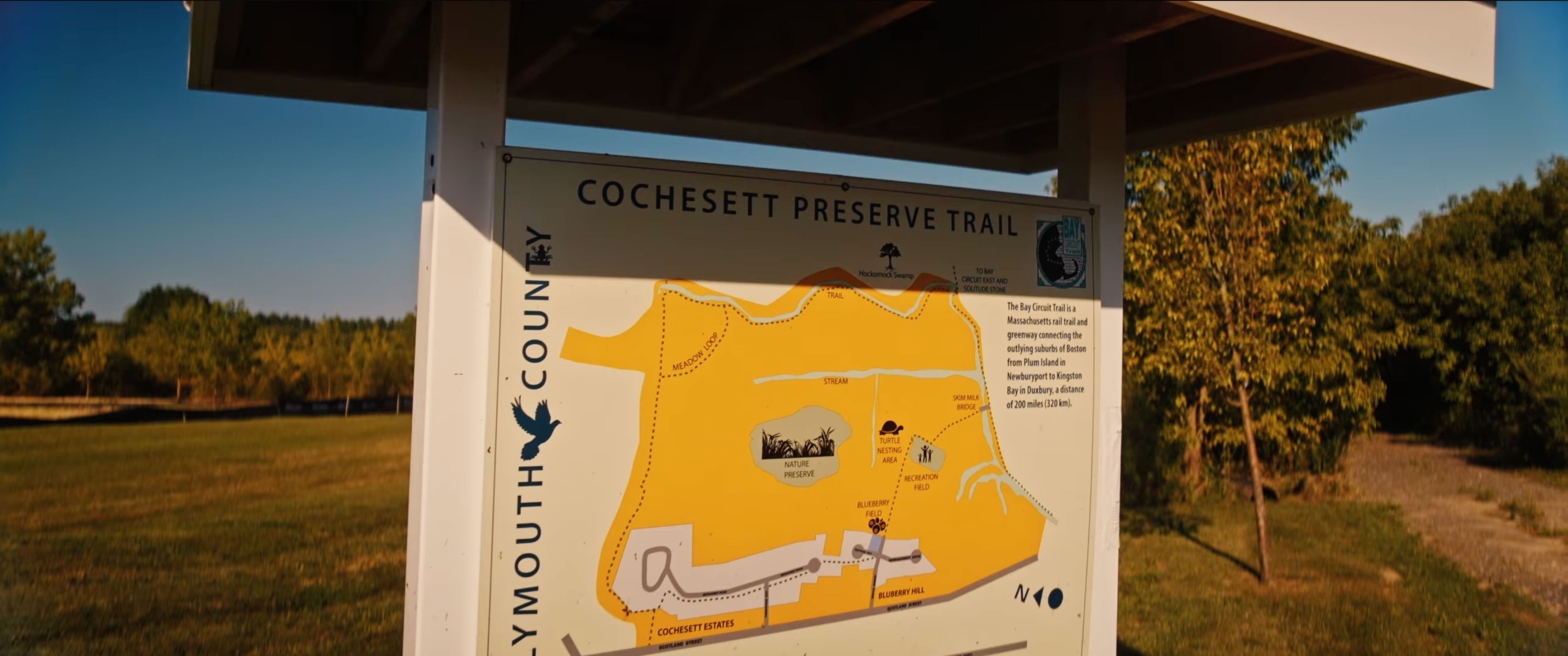 Trail map sign at the Cochesett Preserve trailhead showing Bay Circuit Trail connections in West Bridgewater, Massachusetts.