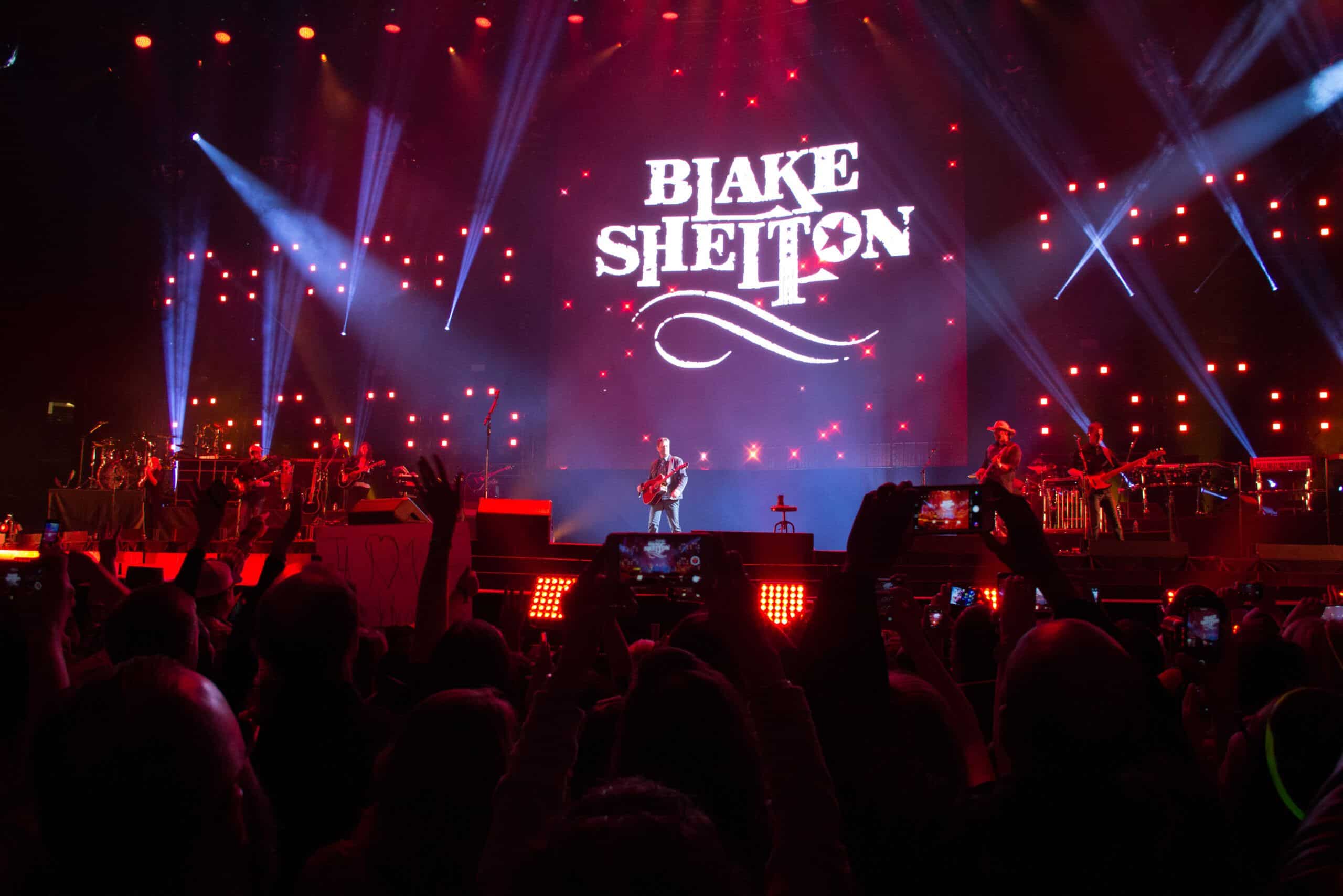 United Way of Metropolitan Dallas  county music artist Blake Shelton on stage with crow in foreground