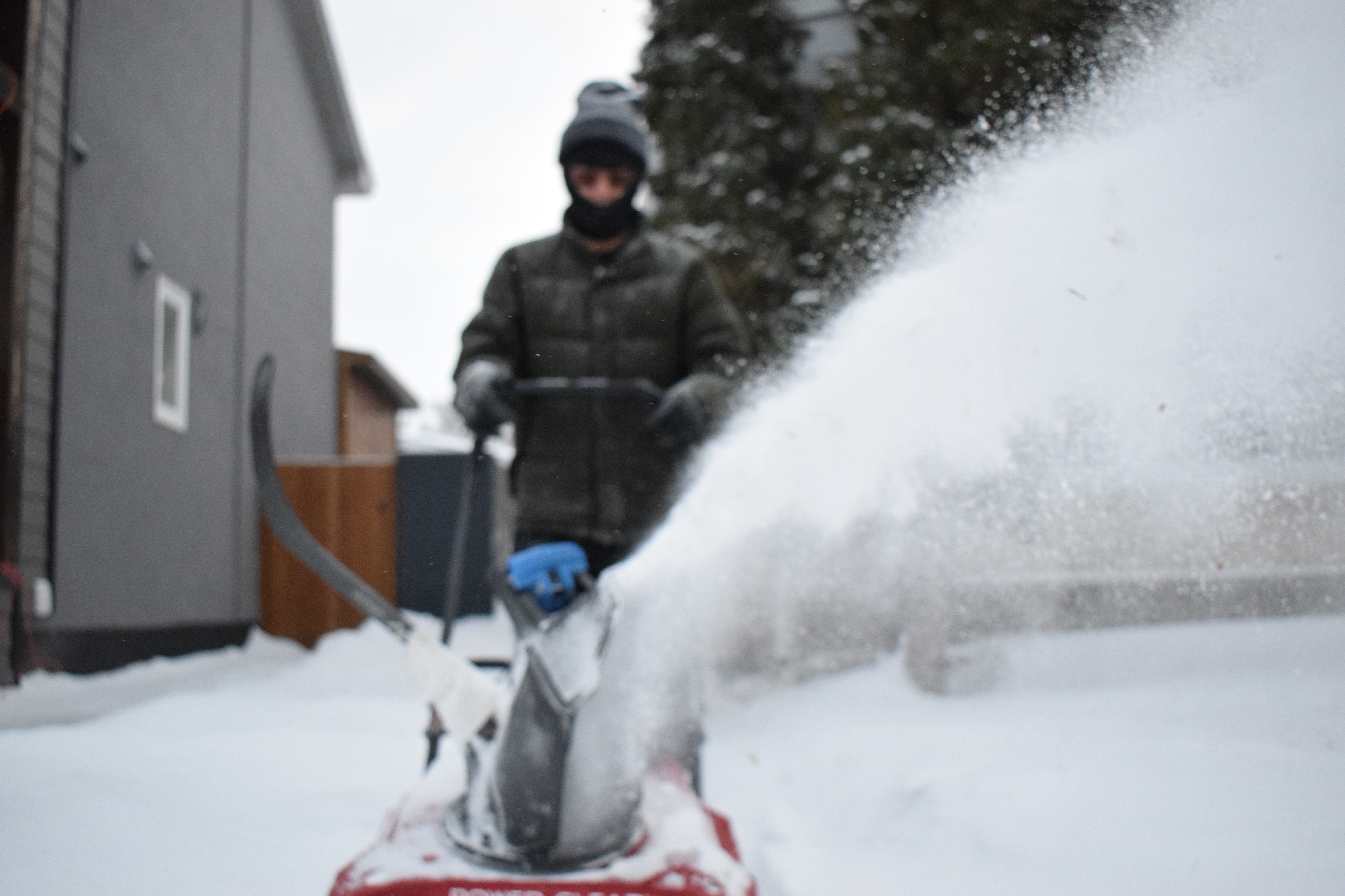 Snow Removal in River Heights, including a driveway