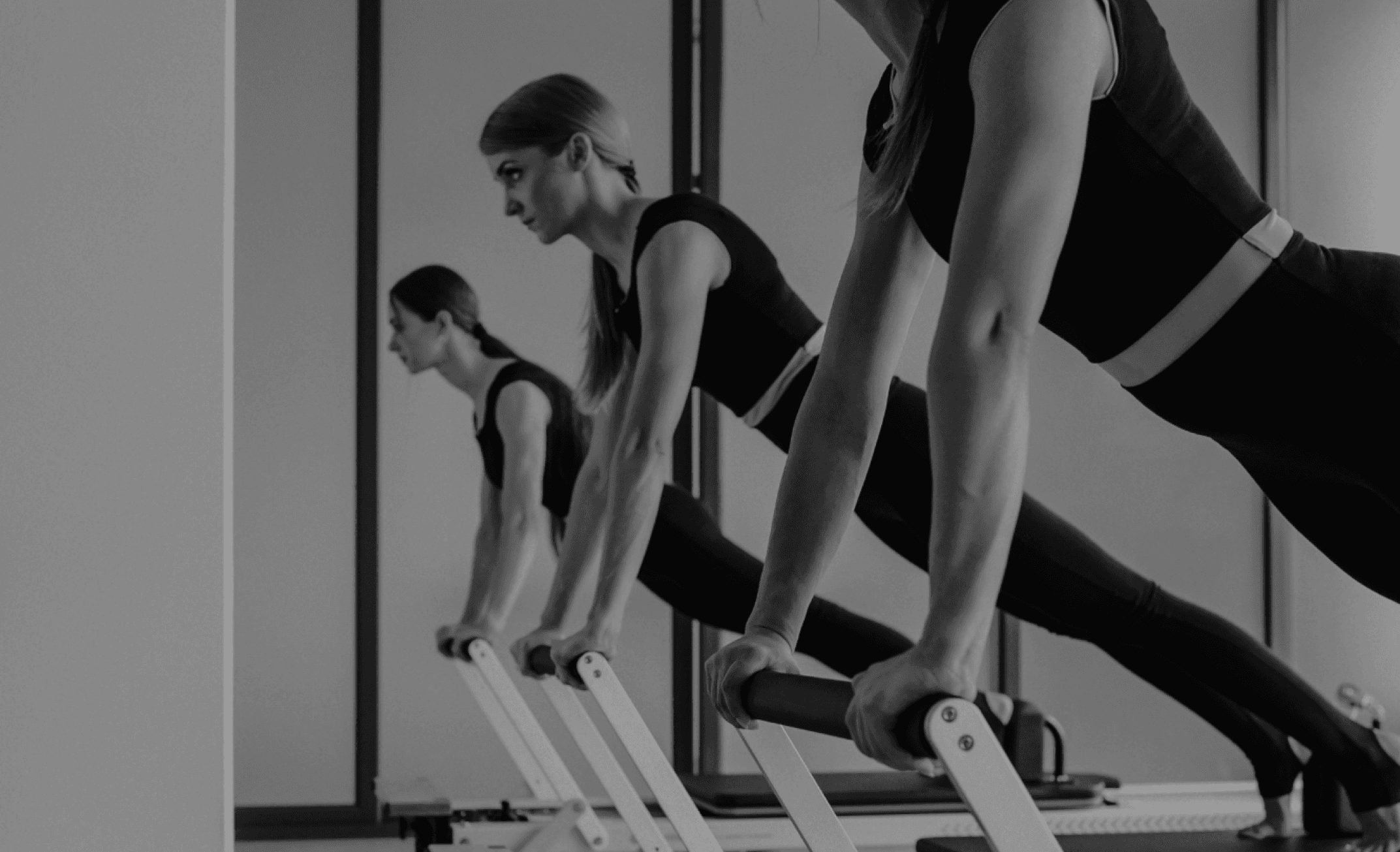 women performing core strengthening pilates exercise