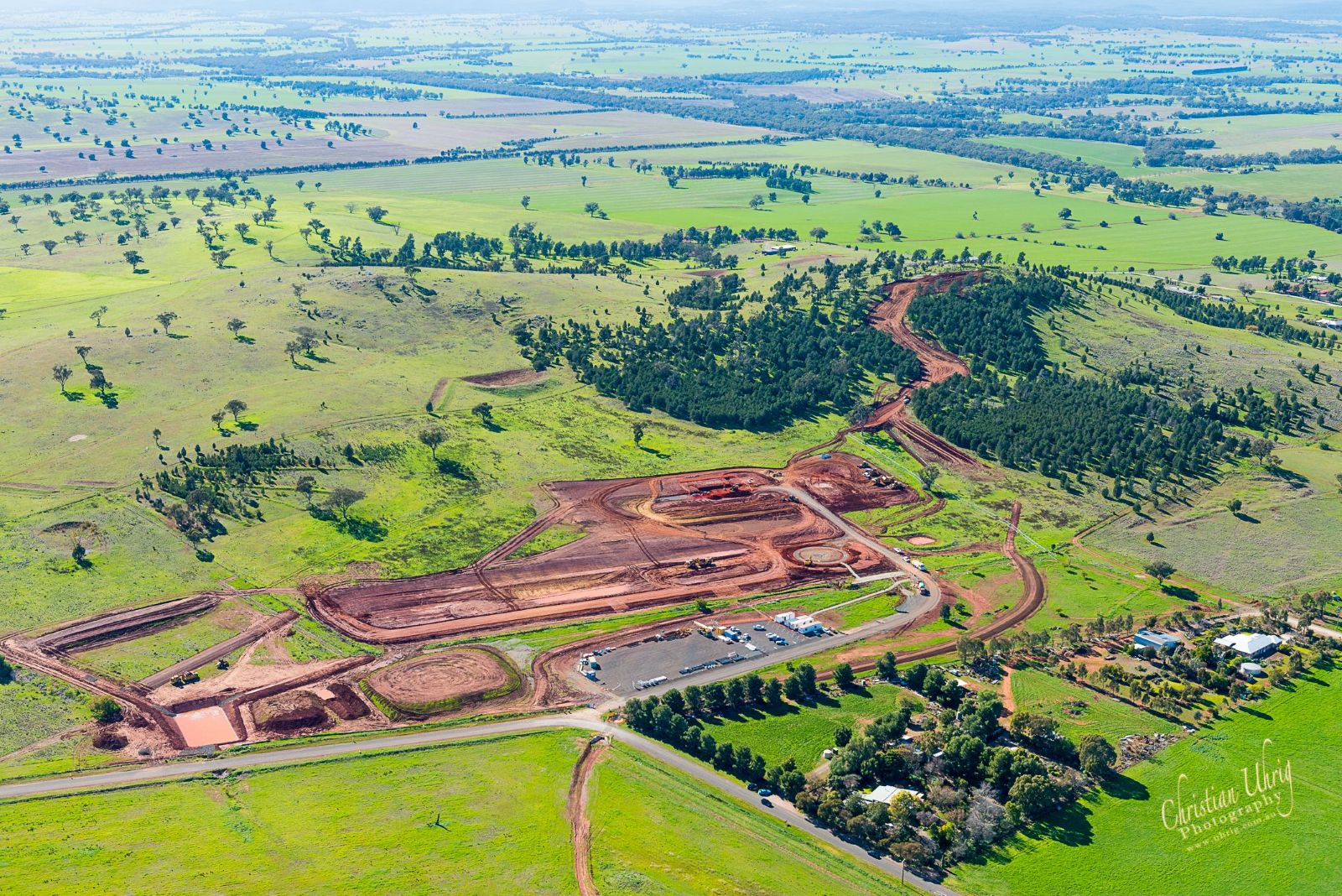 Aerial view of the Parkes Sewage Treatment Plant site showing earthworks, access roads, and surrounding rural landscape during construction.