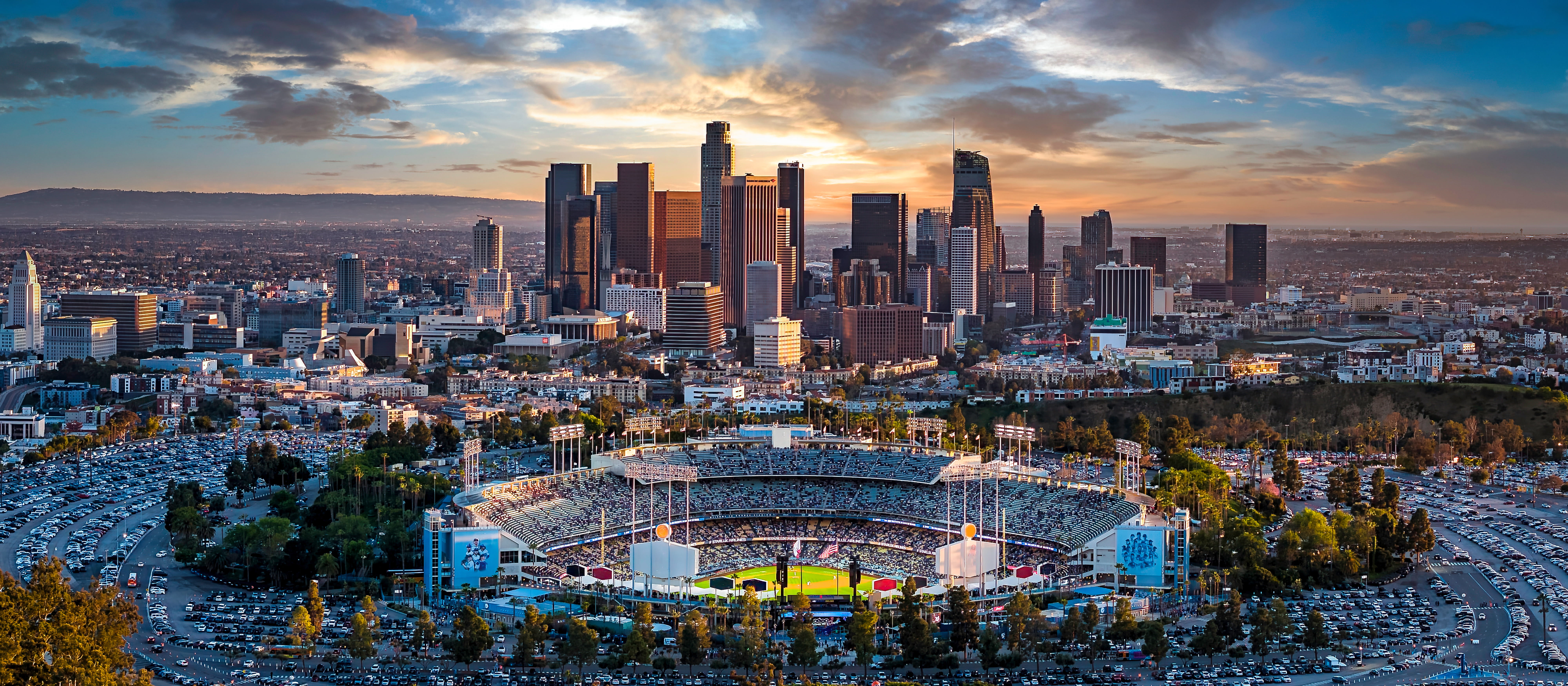 Downtown skyline and Dodger Stadium illustrating Measure ULA Los Angeles market impact
