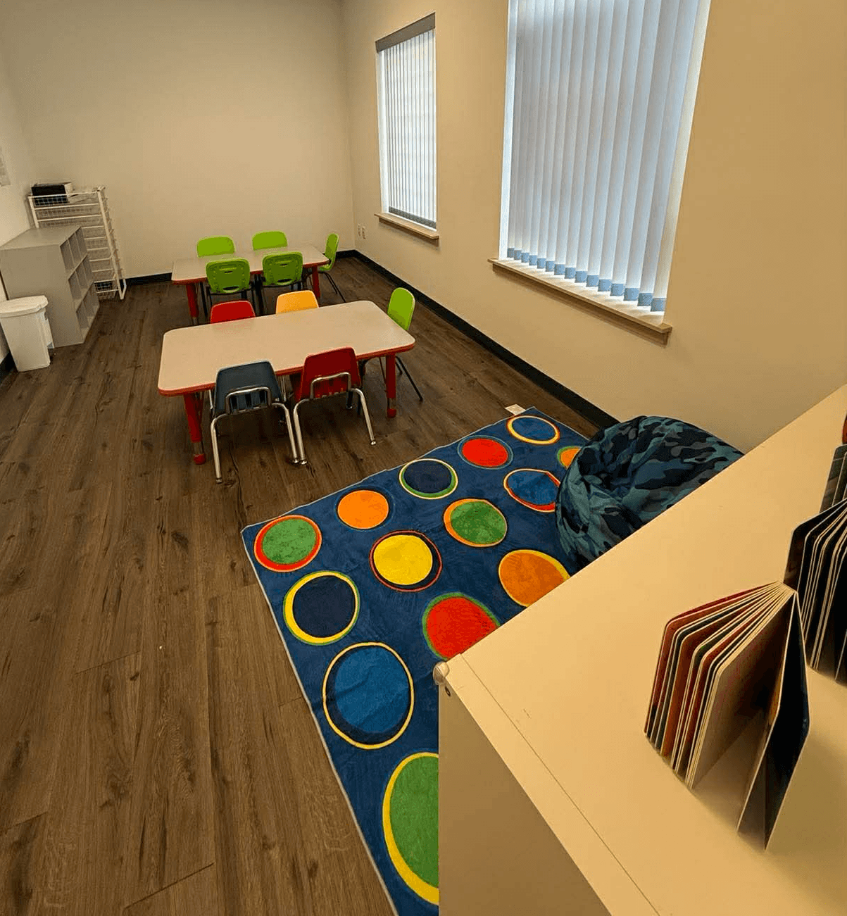 woman in yellow long sleeve shirt sitting by the table